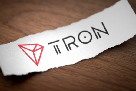 tron-cryptocurrency-logo-on-paper-x300_1px